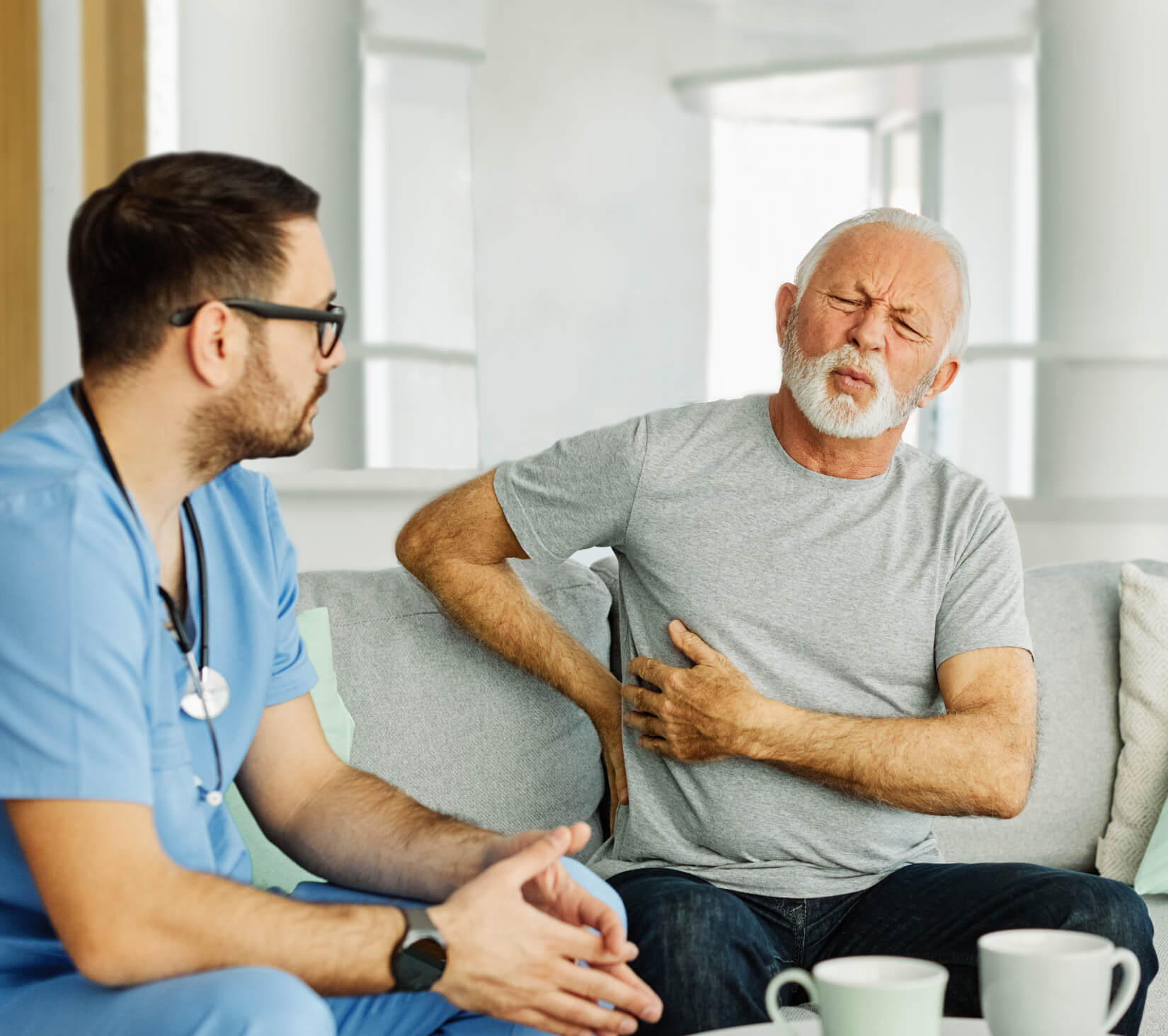 nurse-senior-ache-backache-home-care-patient-pain-YJKHJQ7.jpg